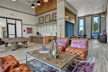 Resident lounge with billiards table and demonstration kitchen